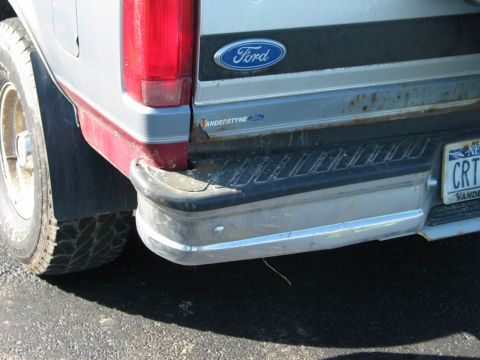 1995 Ford Bronco - Close-up of the rear of a Ford truck, focusing on the bumper and taillight assembly.