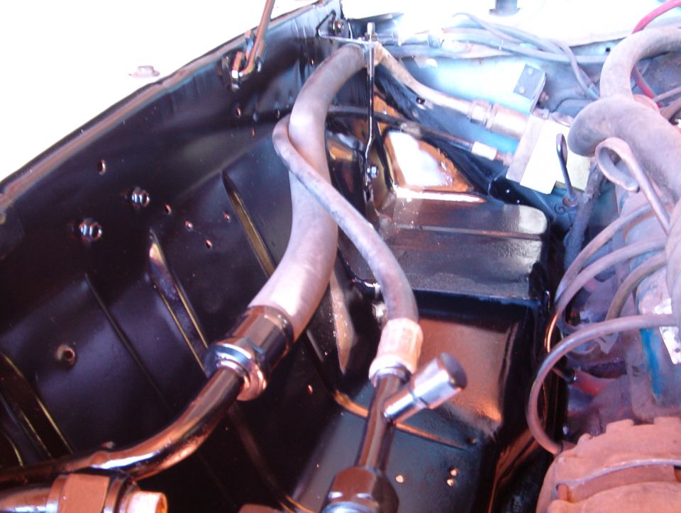 Passenger side engine compartment finished. De-greased, wire brushed, surface rust pits coated with rust converter. Primered and painted semi-gloss black.