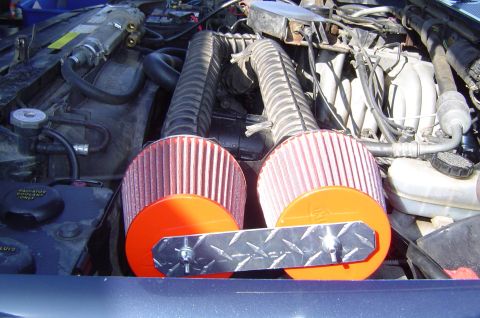 1993 Ford Bronco - Aftermarket K&N air filters installed in the engine bay, mounted with a diamond plate bracket.