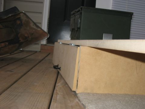 1988 Ford Bronco - A wooden storage box and an olive drab ammo can are visible on a wooden porch.