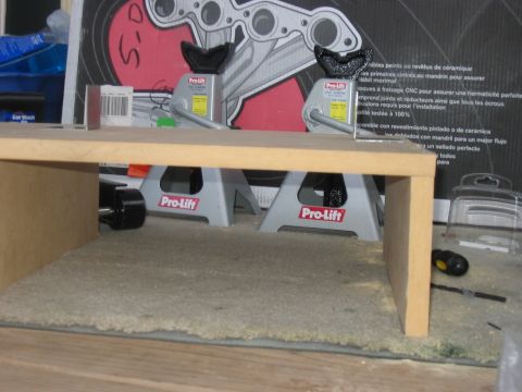 1988 Ford Bronco - Pro-Lift jack stands are shown supporting a wooden structure, with a tire visible on the left side.