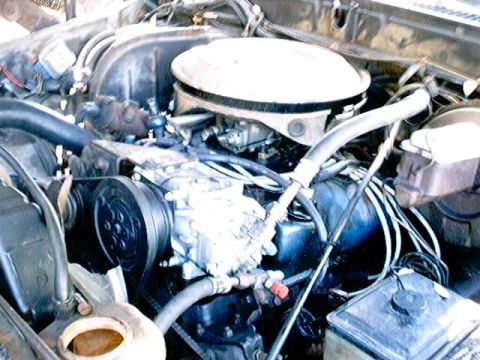 1979 Ford Bronco - Close-up view of the engine compartment, showing various mechanical components and wiring.