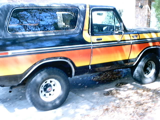 1979 Ford Bronco with orange and yellow stripes