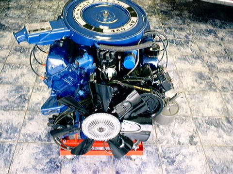 1979 Ford Bronco - A blue Ford 400 V8 engine, identified by its air cleaner badge, is displayed on a stand.