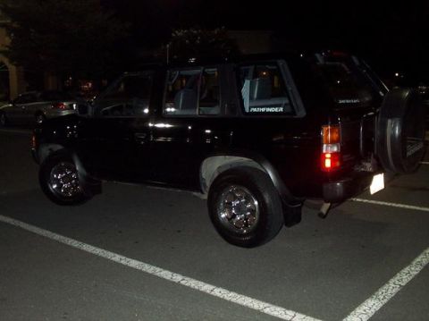 1995 Nissan Pathfinder - This 1995 Nissan Pathfinder is seen from the rear quarter angle at night.