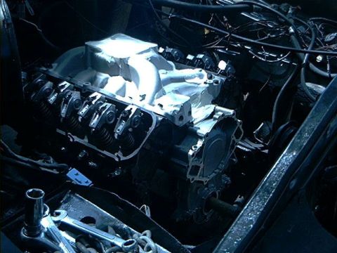 1979 Ford Bronco - Close-up view of an engine, showing the intake manifold and valve train components.