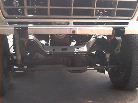 1979 Ford Bronco - Front view of a 1979 Ford Bronco, showing the grille and suspension system.