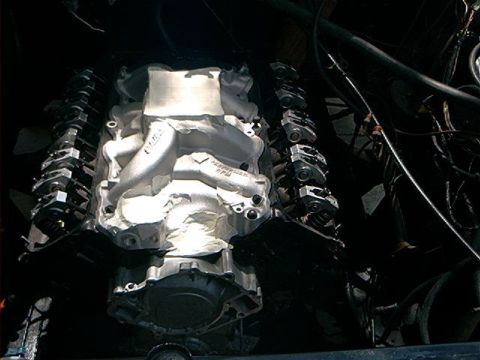 1979 Ford Bronco - Close-up view of an engine assembly, an aluminum intake manifold and valve covers.