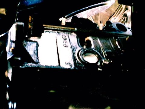 1979 Ford Bronco - Close-up of an engine block showing casting numbers 'E3AE-6015-AB'.