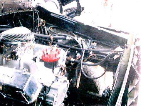 1979 Ford Bronco - Close-up view of a vehicle's engine bay, showing the engine components and wiring.