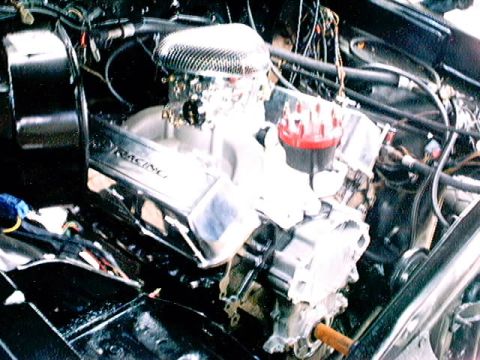 1979 Ford Bronco - Close-up view of a modified engine "RACING" valve covers and a prominent air intake system.