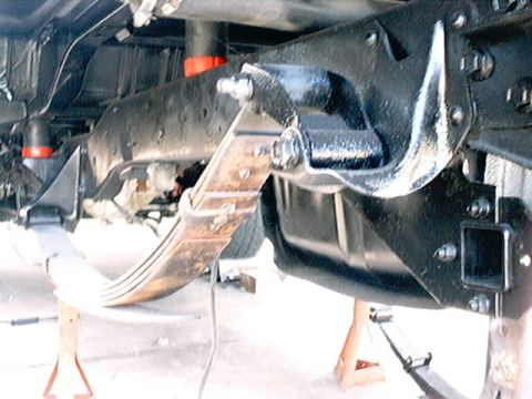 1979 Ford Bronco - Close-up view of the vehicle's undercarriage, focusing on the suspension system.