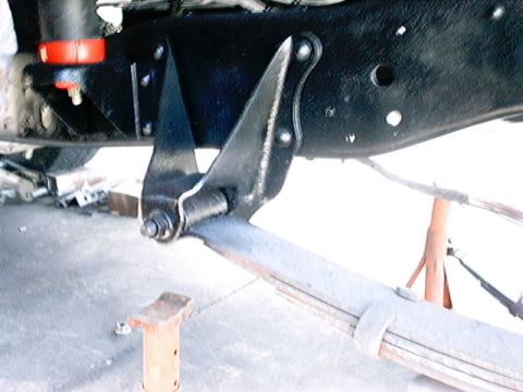 1979 Ford Bronco - Leaf spring and suspension bracket detail on a vehicle.