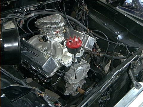 1979 Ford Bronco - Engine bay view shows a modified V8 engine with chrome accents and aftermarket parts.