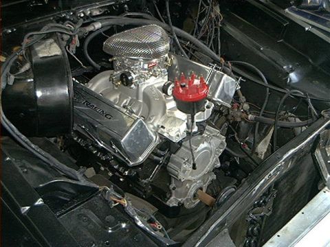 1979 Ford Bronco - Close-up view of a modified engine with chrome valve covers and a prominent air filter assembly.
