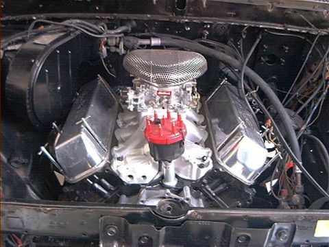 1979 Ford Bronco - Custom V8 engine with aftermarket parts in an engine bay.