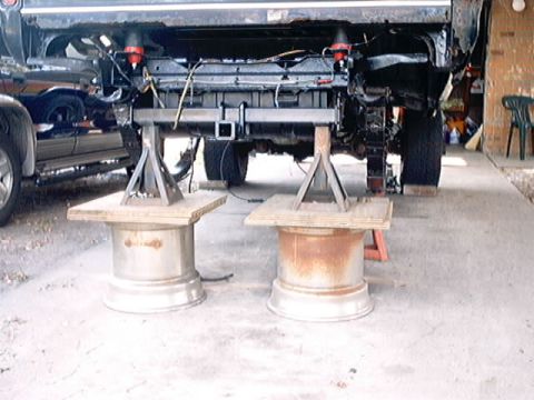 1979 Ford Bronco - Vehicle frame is elevated on jack stands for maintenance or repair work.