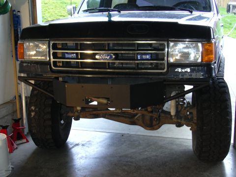 1991 Ford Bronco - Front view of a 1991 Ford Bronco a custom bumper with an integrated winch.