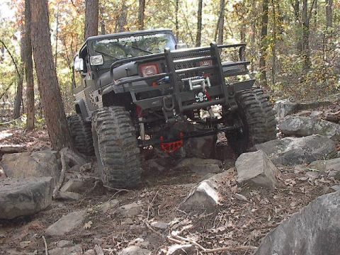 1986 Ford Bronco - Virgil just mows over this huge rock (look under his jeep).