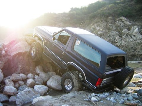 1985 Ford Bronco - This 1985 Ford Bronco navigates a rocky terrain, its off-road capabilities.