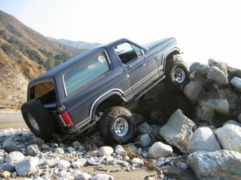 1985 Ford Bronco - This 1985 Ford Bronco is navigating a challenging rocky terrain.