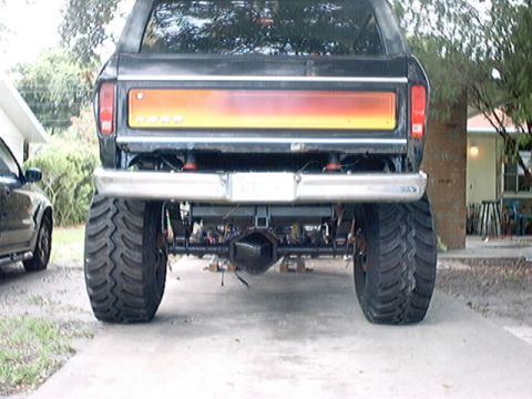 1979 Ford Bronco - This lifted 1979 Ford Bronco features oversized tires and a distinctive red-to-yellow tailgate panel.