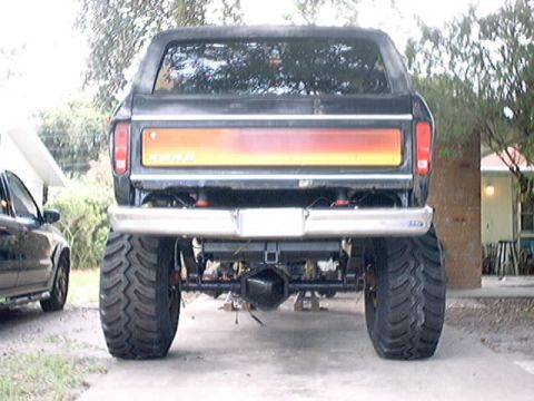 1979 Ford Bronco - This lifted Ford Bronco has a distinctive red and yellow taillight panel and massive off-road tires.