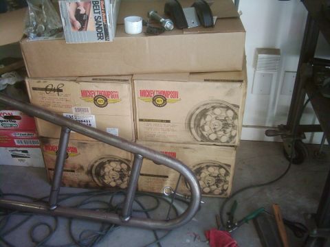 1978 Ford Bronco - Unidentified metal fabrication part sits in front of several boxes of Mickey Thompson wheels.