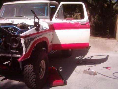1978 Ford Bronco - This 1978 Ford Bronco is in a state of repair, with its hood open and driver's door removed.