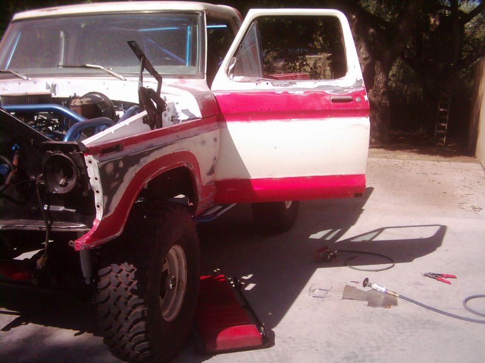 1978 Ford Bronco, white and red, undergoing repairs, hood open, driver door ajar