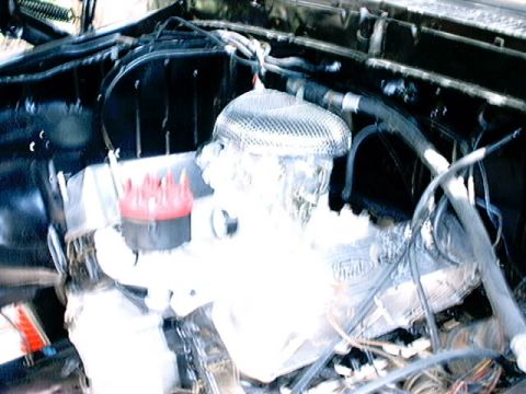 1979 Ford Bronco - Close-up view of a vehicle's engine compartment, showing various components.