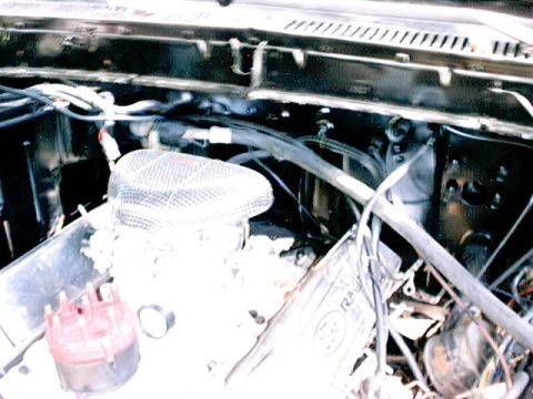 1979 Ford Bronco - The engine bay of a 1979 Ford Bronco shows an aftermarket air cleaner and distributor cap.