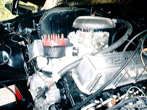 1979 Ford Bronco - Close-up view of a Ford Racing engine, showing the air cleaner and distributor cap.