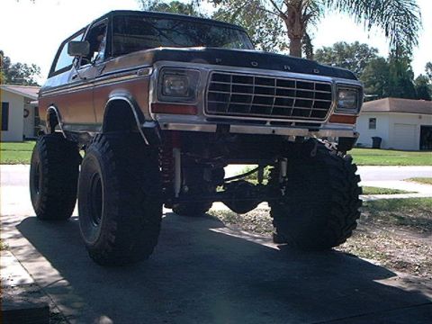 1979 Ford Bronco - This lifted Ford Bronco has massive tires and a prominent grille, suggesting a 1978 model year.