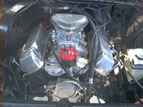 1979 Ford Bronco - Close-up view of a modified engine bay, showing custom components and wiring.