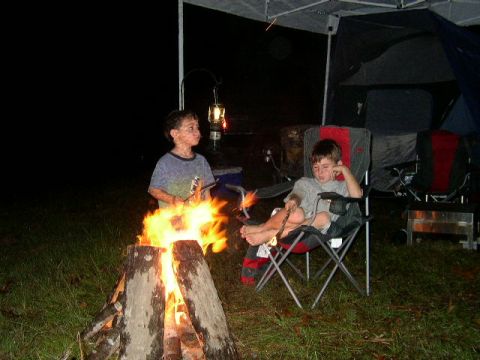 1995 Ford Bronco - Children enjoy a campfire and camping at night.