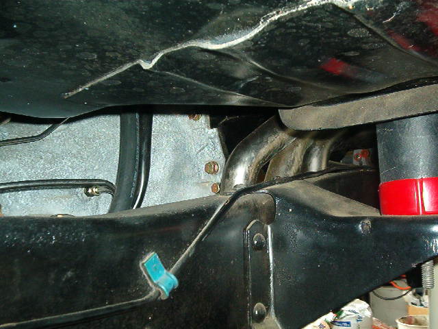 Close-up of exhaust manifold and frame components