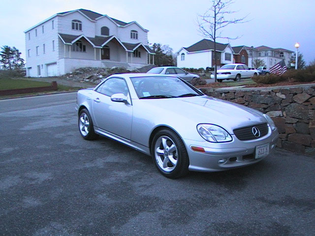 Silver convertible with a "SUPERMOTORS.NET" watermark