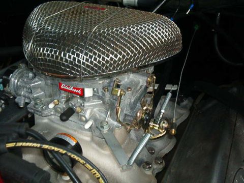 1979 Ford Bronco - Close-up of an Edelbrock carburetor and chrome air cleaner assembly.
