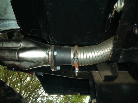 1979 Ford Bronco - Underside view of a vehicle's exhaust system, showing a flexible pipe connecting to the manifold.