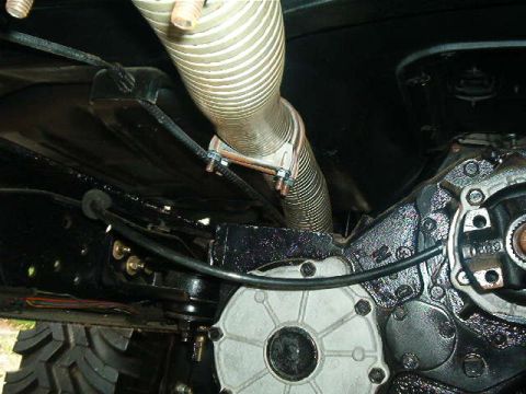 1979 Ford Bronco - Close-up view of the undercarriage, focusing on the exhaust system and drivetrain components.