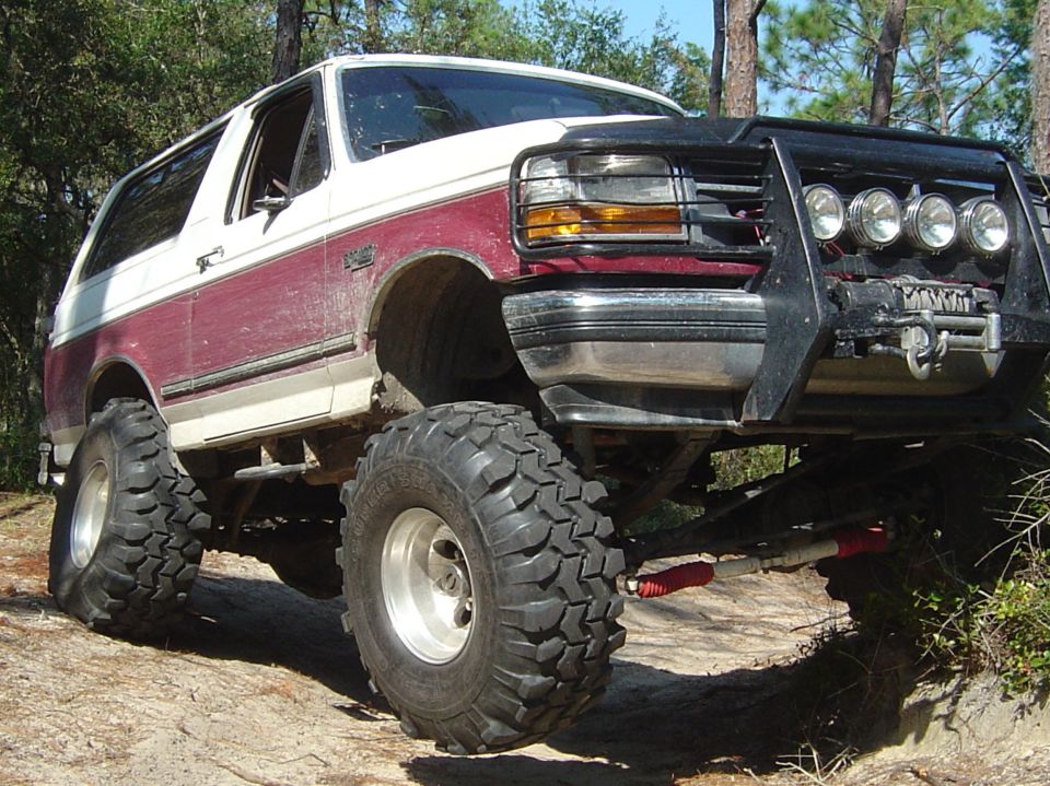 Lifted 1993 Ford Bronco with large tires and bull bar
