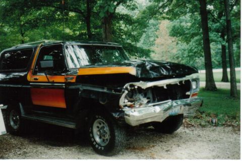 1979 Ford Bronco - This Ford Bronco has significant damage to its front end and hood.