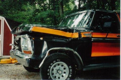 1979 Ford Bronco - This damaged 1978 Ford Bronco shows significant front-end collision impact.