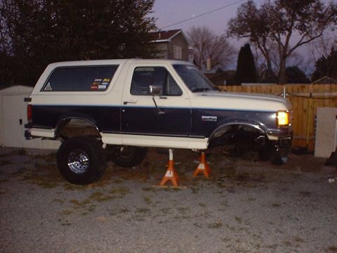 1988 Ford Bronco - This 1988 Ford Bronco is elevated on jack stands, with its front end undergoing maintenance.