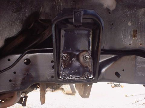 1988 Ford Bronco - Close-up view of an assembled front axle component attached to a vehicle's frame.
