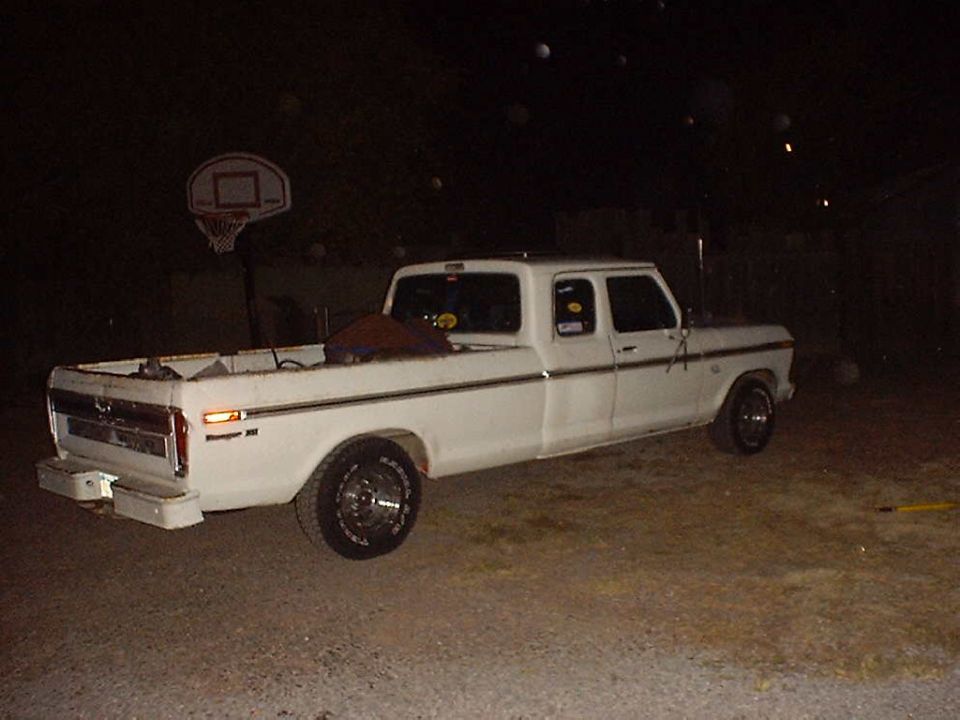 White Ford F-Series SuperCab pickup truck, likely 1977 model year