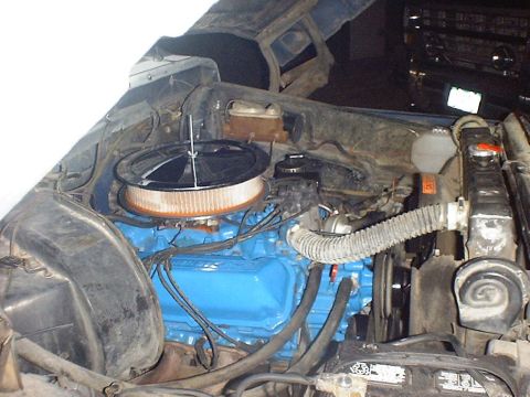 1988 Ford Bronco - Close-up view of an engine bay with various components visible.