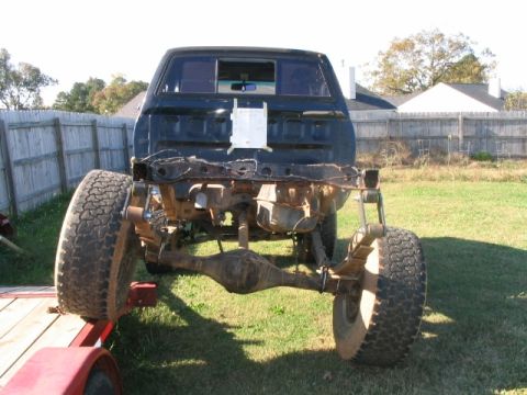 1986 Ford F-150 - This 1986 Ford F-150 pickup truck is viewed from the rear, revealing its chassis and suspension components.