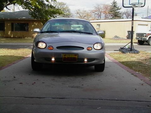 1999 Ford Taurus - Front view of a 1999 Ford Taurus parked on a concrete driveway.